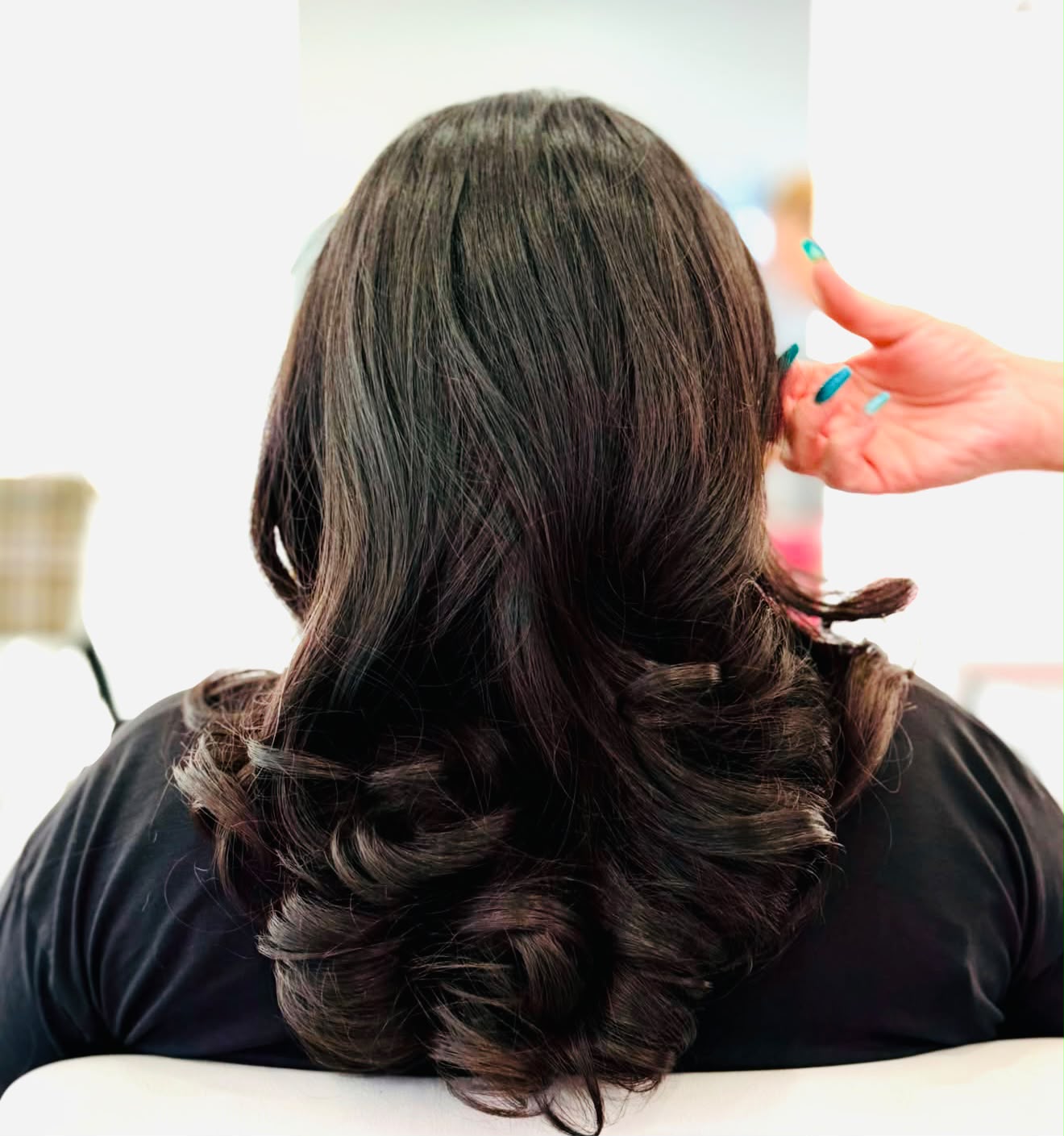 Brunette voluminous blowout curls