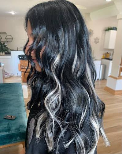 Jet black hair with platinum money-piece highlights